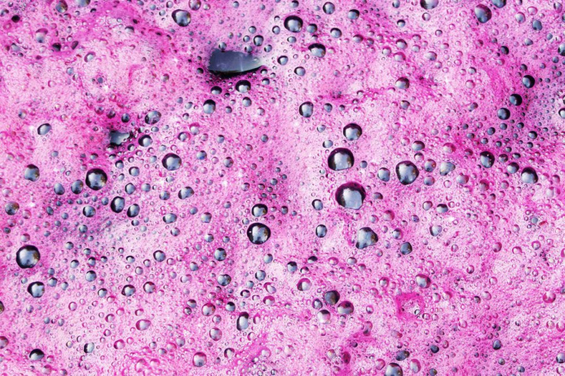   Texture ng red wine foam, Wine fermentation in process, How to make wine concept.