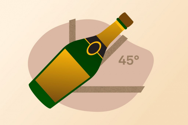  Ilustrácia fľaše šampanského držanej pod uhlom 45 stupňov